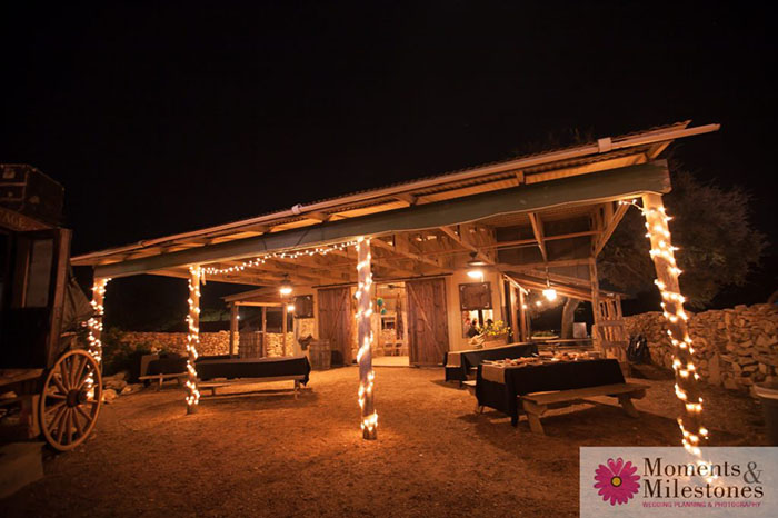 illuminated patio with tables setup in the night time